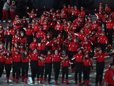 Canadian Olympic athletes march in the athletes march during the closing ceremony of the PyeongChang 2018 Olympic Winter Games at the PyeongChang Olympic Stadium, February 25, 2018.   Photo by Jean Levac/Postmedia