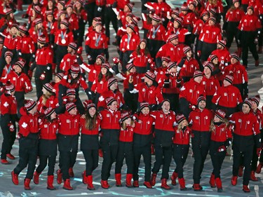 Canadian Olympic athletes march in the athletes march during the closing ceremony of the PyeongChang 2018 Olympic Winter Games at the PyeongChang Olympic Stadium, February 25, 2018.   Photo by Jean Levac/Postmedia