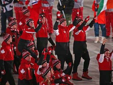 Canadian Olympic athletes march in the athletes march during the closing ceremony of the PyeongChang 2018 Olympic Winter Games at the PyeongChang Olympic Stadium, February 25, 2018.   Photo by Jean Levac/Postmedia