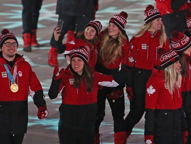 Canadian Olympic athletes march in the athletes march during the closing ceremony of the PyeongChang 2018 Olympic Winter Games at the PyeongChang Olympic Stadium, February 25, 2018.   Photo by Jean Levac/Postmedia