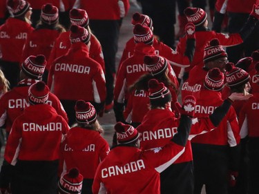 Canadian Olympic athletes march in the athletes march during the closing ceremony of the PyeongChang 2018 Olympic Winter Games at the PyeongChang Olympic Stadium, February 25, 2018.   Photo by Jean Levac/Postmedia