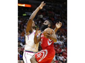 Houston Rockets guard James Harden (13) goes up for a shot against Miami Heat center Hassan Whiteside (21) during the first half of an NBA basketball game, Wednesday, Feb. 7, 2018, in Miami.