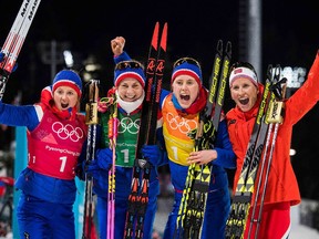 Norway's Ingvild Flugstad Oestberg, Astrid Uhrenholdt Jacobsen, Ragnhild Haga and Marit Bjorgen celebrate after winning the women's 4x5-kilometre classic freestyle cross-country relay on Feb. 17, 2018 in Pyeongchang.