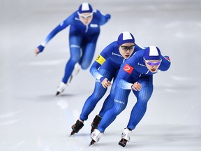 South Korea's Kim Bo-Reum, front, and Park Ji Woo, centre, skate away from teammate Noh Seon-Yeong in a women's team pursuit quarter-final on Feb. 19, 2018. The incident has touched a nerve with the public.
