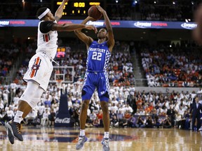 Kentucky guard Shai Gilgeous-Alexander shoots and scores against Auburn guard Bryce Brown during the first half of an NCAA college basketball game on Wednesday, Feb. 14, 2018, in Auburn, Ala.