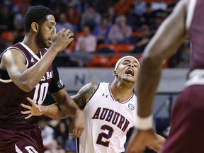 Auburn guard Bryce Brown reacts to being fouled by Texas A&M center Tonny Trocha-Morelos during the first half of an NCAA college basketball game on Wednesday, Feb. 7, 2018, in Auburn, Ala.