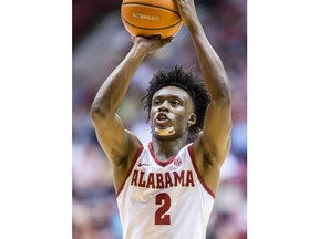 Alabama guard Collin Sexton shoots a free throw during the first half against Arkansas in an NCAA college basketball game Saturday, Feb. 24, 2018, in Tuscaloosa, Ala.