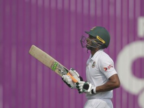 Bangladesh's captain Mahmudullah walks back to the pavilion after his dismissal by Sri Lanka's Akila Dananjaya during the second day of the second and final test cricket match in Dhaka, Bangladesh, Friday, Feb. 9, 2018.