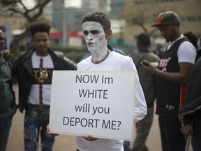 African asylum seekers protest their pending deportations from Israel in front of the Rwandan embassy in Herzeliya, Israel, on Feb. 7, 2018.