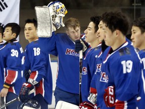 In this Feb. 22, 2017 file photo, Canadian-born South Korean goaltender Matt Dalton, waves after a game against Kazakhstan at the Asian Winter Games in Sapporo, Japan.