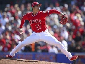 Los Angeles Angels' Shohei Ohtani works against the Milwaukee Brewers during the first inning of a spring training baseball game on Saturday, Feb. 24, 2018, in Tempe, Ariz.