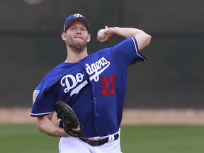 Los Angeles Dodgers starting pitcher Clayton Kershaw throws at the team's spring training baseball facility Wednesday, Feb. 14, 2018, in Glendale, Ariz. Kershaw has already been tabbed for a record eighth start on opening day for the Dodgers. The rest of the rotation is also familiar for the defending NL champions, even without Yu Darvish, after coming up one win short of a World Series title last season.