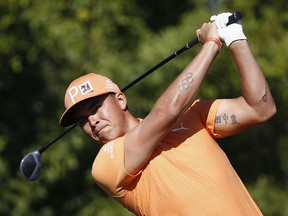 Rickie Fowler tees off at the second hole during the final round of the Waste Management Phoenix Open golf tournament Sunday, Feb. 4, 2018, in Scottsdale, Ariz.