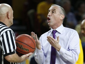 Arizona State coach Bobby Hurley, right, argues with an official during the first half of the team's NCAA basketball game against Southern California on Thursday, Feb. 8, 2018, in Tempe, Ariz.