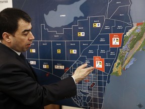 Lebanon's Energy Minister Cesar Abi Khalil, explains on the map about the offshore block 9 which Israel claims, during an interview with the Associated Press at his office, in Beirut, Lebanon, Thursday, Feb. 1, 2018. Abi Khalil has vowed the country will go ahead in its oil and gas exploration tender near its maritime border with Israel despite Israeli claims the field belongs to it.