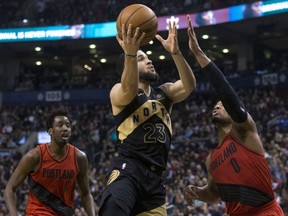 Fred VanVleet of the Raptors drives to the basket against the Portland Trail Blazers' Damian Lillard during second half action in Toronto on Friday night.