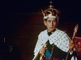 In this 1969 file photo, Britain's Prince Charles, the Prince Of Wales poses for a photo dressed in his investiture regalia.