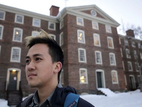FILE - In this Feb. 14, 2017 file photo, Viet Nguyen poses for a portrait on the Brown University campus in Providence, R.I. Nguyen, now an alumnus, helped lead an effort urging Brown and other elite universities to rethink their legacy admissions policies.