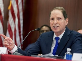 FILE - In this Dec. 13, 2017 file photo, Sen. Ron Wyden, D-Ore., the top Democrat on the Senate Finance Committee speaks during a House and Senate conference on Capitol Hill in Washington. Wyden is seeking documents from the National Rifle Association and the Treasury Department following reports of an FBI investigation into whether a Russian central banker funneled money to the group during the 2016 presidential campaign. In letters sent to Treasury Secretary Steven Mnuchin and the NRA on Friday, Feb. 2, 2018, Wyden requested any documents showing financial links between Russia and the gun lobbying organization.