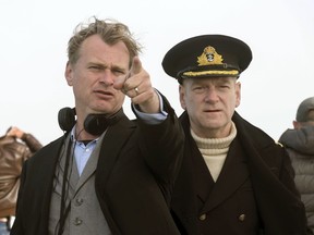 This image released by Warner Bros. Pictures shows director Christopher Nolan, left, on the set of "Dunkirk" with actor Kenneth Branagh. Nolan is nominated for honors at both the Directors Guild Awards on Saturday, Feb. 3, 2018, and the Academy Awards next month.