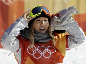 FILE - In this Tuesday, Feb. 13, 2018 file photo, Chloe Kim, of the United States, smiles during the women's halfpipe finals at Phoenix Snow Park at the 2018 Winter Olympics in Pyeongchang, South Korea. A San Francisco Bay Area radio station has fired one of its hosts, Patrick Connor, after he made sexual comments about 17-year-old Olympic snowboarder Kim on another station. Program director Jeremiah Crowe of KNBR-AM, where Connor hosted "The Shower Hour," confirmed the firing Wednesday, Feb. 14, 2018, for NBC Bay Area.