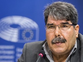 FILE - In this Sept. 1, 2016 file photo, then co-chair of the Syrian Kurdish Democratic Union Party (PYD) Salih Muslim addresses journalists at the European Parliament in Brussels. Turkey's official news agency, Anadolu, and a Syrian Kurdish official said Sunday, Feb. 25, 2018, that Czech authorities have detained Muslim under an Interpol red notice based on Ankara's request for his arrest. Muslim was put on Turkey's most-wanted list earlier in February with a reward for $1 million.