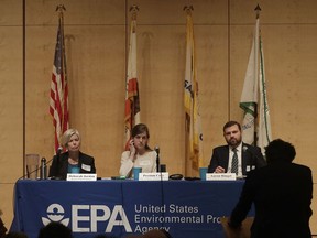 The U.S. Environmental Protection Agency's Deborah Jordan, seated from left, Preston Cory and Aaron Ringel listen to a speaker at an Environmental Protection Agency listening session in San Francisco, Wednesday, Feb. 28, 2018. California stands in "complete opposition" to a Trump administration plan to scrap a policy slashing climate-changing emissions from power plants, its top air official said Wednesday at a U.S. hearing in a state helping lead the fight against global warming.