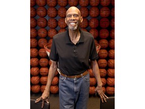 In this Monday, Feb. 12, 2018 photo, Kareem Abdul-Jabbar poses in his office, in Newport Beach, Calif. Abdul-Jabbar has been a best-selling author, civil-rights activist, actor, historian and one of the greatest basketball players who ever lived. This fall Abdul-Jabbar will embark on a cross-country tour as part of "Becoming Kareem," a stage show in which he'll discuss his life, answer audience questions and talk about the key mentors in his life he says helped him achieve his goals along the way.