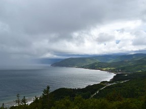 This 2014 photo shows the northwestern coastline of Nova Scotia’s Cape Breton Island as a squall rolls in from the Gulf of St. Lawrence along the Cabot Trail in Cape Breton Highlands National Park.