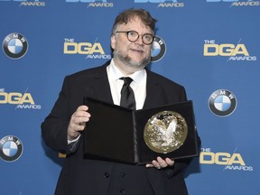 Guillermo del Toro poses in the press room with a plaque honoring his nomination for outstanding directorial achievement in a feature film for "The Shape of Water" at the 70th annual Directors Guild of America Awards at The Beverly Hilton hotel on Saturday, Feb. 3, 2018, in Beverly Hills, Calif.