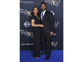 Zinzi Evans, left, and Ryan Coogler arrive at the world premiere of "A Wrinkle in Time" at the El Capitan Theatre on Monday, Feb. 26, 2018, in Los Angeles.