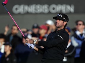 Bubba Watson watches his tee shot on the tenth hole during the second round of the Genesis Open golf tournament at Riviera Country Club Friday, Feb. 16, 2018, in the Pacific Palisades area of Los Angeles.