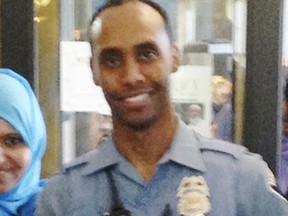 FILE - In this May 2016 image provided by the City of Minneapolis, police officer Mohamed Noor poses for a photo at a community event welcoming him to the Minneapolis police force. Noor fatally shot Justine Ruszczyk Damond, an Australian native on July 15, 2017. The grand jury is scheduled to begin its work Tuesday, Feb. 6, 2018, as prosecutors decide whether to charge Noor in Damond's death. (City of Minneapolis via AP, File)