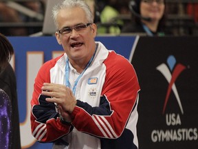 FILE - In this March 3, 2012, file photo, gymnastics coach John Geddert is seen at the American Cup gymnastics meet at Madison Square Garden in New York. Geddert, a former U.S. women's gymnastics national team coach, is facing a criminal investigation in Michigan after the sentencing of disgraced ex-sports doctor Larry Nassar, who treated girls at his elite club Twistars near Lansing. The Eaton County Sheriff's Office said Tuesday, Feb. 6, 2018, people have recently come forward with complaints against Geddert.