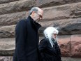 David Livingston arrives with his wife Anne Grittani for his sentencing at court in Toronto on Monday, Feb. 26, 2018.