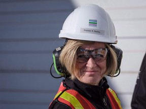 Alberta Premier Rachel Notley tours a company producing pipe, casing and tubing for the Canadian oil and gas sector in Calgary, Alta., Friday, Feb. 9, 2018. Notley says she wants progress within days from Ottawa in resolving a pipeline dispute with British Columbia, or her government will look at further retaliatory measures.