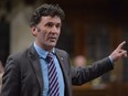 NDP MP Paul Dewar asks a question during Question Period in the House of Commons in Ottawa on September 29, 2014. A former NDP member of parliament says he underwent surgery after being diagnosed with brain cancer. Paul Dewar, 55, who represented Ottawa Centre from 2006 until 2015, says in a Facebook post that he was diagnosed with a brain tumour earlier this month after experiencing discomfort in his arm.