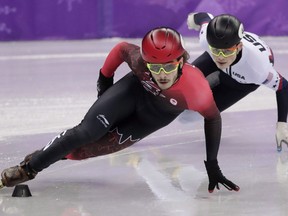 With 15 medals (five gold, five silver, five bronze) in the bank by Saturday, Canadians tabbed as medal favourites delivered for the most part in the front half. Samuel Girard of Canada leads John-Henry Krueger of the United States during their men's 1000 meters short track speedskating final in the Gangneung Ice Arena at the 2018 Winter Olympics in Gangneung, South Korea, Saturday, Feb. 17, 2018. Girard won the gold.