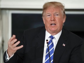 President Donald Trump speaks in the State Dining Room of the White House in Washington, Monday, Feb. 12, 2018. The White House is dowmplaying a threat from President Donald Trump to impose new import tax.