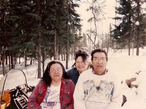 Ina Matawapit, centre, with her parents Edward and Madeline Matawapit, are seen in an undated handout photo. An inquest probing the circumstances surrounding the 2012 death of an Ontario Indigenous woman is recommending stricter protocols for handling intoxicated patients.