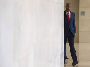 Minister of Immigration, Refugees and Citizenship Ahmed Hussen makes his way to appear before the Commons Citizenship and Immigration committee in Ottawa, Thursday November 23, 2017. The federal Immigration Minister is under pressure to move ahead with promised changes to how Canada decides on whether to admit people with certain medical conditions.