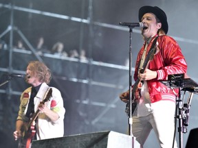 Richard Reed Parry and Win Butler of Arcade Fire perform on Day 4 at Lollapalooza in Grant Park in Chicago on August 6, 2017. Arcade Fire and Jessie Reyez are the leading nominees at this year's Juno Awards in Vancouver.Arcade Fire is in the running for best group, single, album and alternative album.