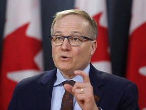 NDP finance critic Peter Julian speaks at a press conference as he unveils the NDP's top priorities ahead of the federal budget on Tuesday, February 13, 2018. With no fix in sight for the troubled Phoenix pay system, the opposition New Democrats are calling on the federal government to compensate employees struggling with pay problems, and to formally apologize.