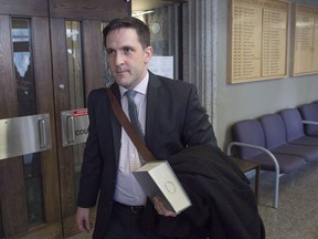 Benjamin Perryman, Abdoul Abdi's lawyer, heads from Federal Court after a hearing to determine whether deportation proceedings should be halted for the former child refugee, in Halifax on Thursday, Feb. 15, 2018. A former Somali child refugee's request to temporarily halt his deportation proceedings has been rejected by the Federal Court.