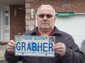 Lorne Grabher displays his personalized licence plate in Dartmouth, N.S. on Friday, March 24, 2017. A Nova Scotia retiree who is fighting to regain a personalized licence plate after it was deemed unacceptable is back in court today.