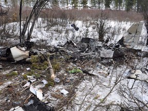 The scene of a plane crash is shown near Cochrane, Alta., in this February 2017 handout photo. The Transportation Safety Board says it doesn't know what caused a plane operated by Mount Royal University's flight school to lose control and crash northwest of Calgary last year.The crash on Feb. 13 of last year killed pilot Jeffrey Bird and co-pilot Reynold Johnson, who were both instructors with the program. A TSB investigation released Thursday says for unknown reasons the aircraft entered a spin from a stall exercise about a half hour after it took off from the Calgary/Springbank Airport.