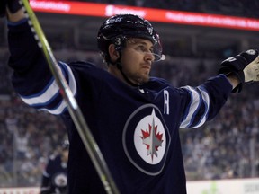 Winnipeg Jets' Mark Scheifele (55), celebrates after scoring against the Ottawa Senators during first period NHL hockey action in Winnipeg, Sunday, December 3, 2017. Scheifele took part in his first full-contact practice Monday. But the Winnipeg Jets centre isn't quite ready to play in his first game since suffering an upper-body injury Dec. 27.