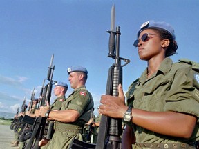 Canadian Peacekeepers prepare for a parade at Maple Leaf Camp in Port-au-Prince on Nov. 28,1997. Canada is looking at ways to help other countries boost the number of female peacekeepers, despite having only a handful of Canadian women in blue helmets and berets. Global Affairs Canada is hosting a session today with representatives from the United Nations and other several countries to brainstorm ways to get more female peacekeepers deployed into the field.