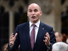 Minister of Families, Children and Social Development Jean-Yves Duclos rises during Question Period in the House of Commons on Parliament Hill in Ottawa on Wednesday, Feb. 7, 2018. Canadians want the federal government to find a way to make it easier to cover the basic costs of living as part of a sweeping poverty-reduction strategy, the minister in charge of the file says.