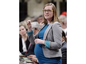 Minister of Democratic Institutions Karina Gould rises during question period in the House of Commons in Ottawa on Wednesday, Jan. 31, 2017. Democratic Institutions Minister Karina Gould is about to become the first federal cabinet minister in history to take a maternity leave. Gould is expecting her first child in early March and will go on maternity leave until at least May after the baby is born.THE CANADIAN PRESS/Adrian Wyld